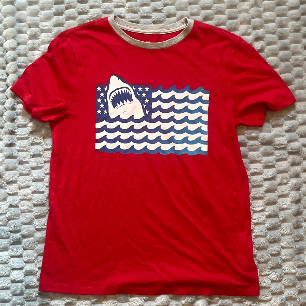 Gap kids red shirt with blue and white waves sporting a shark and stars